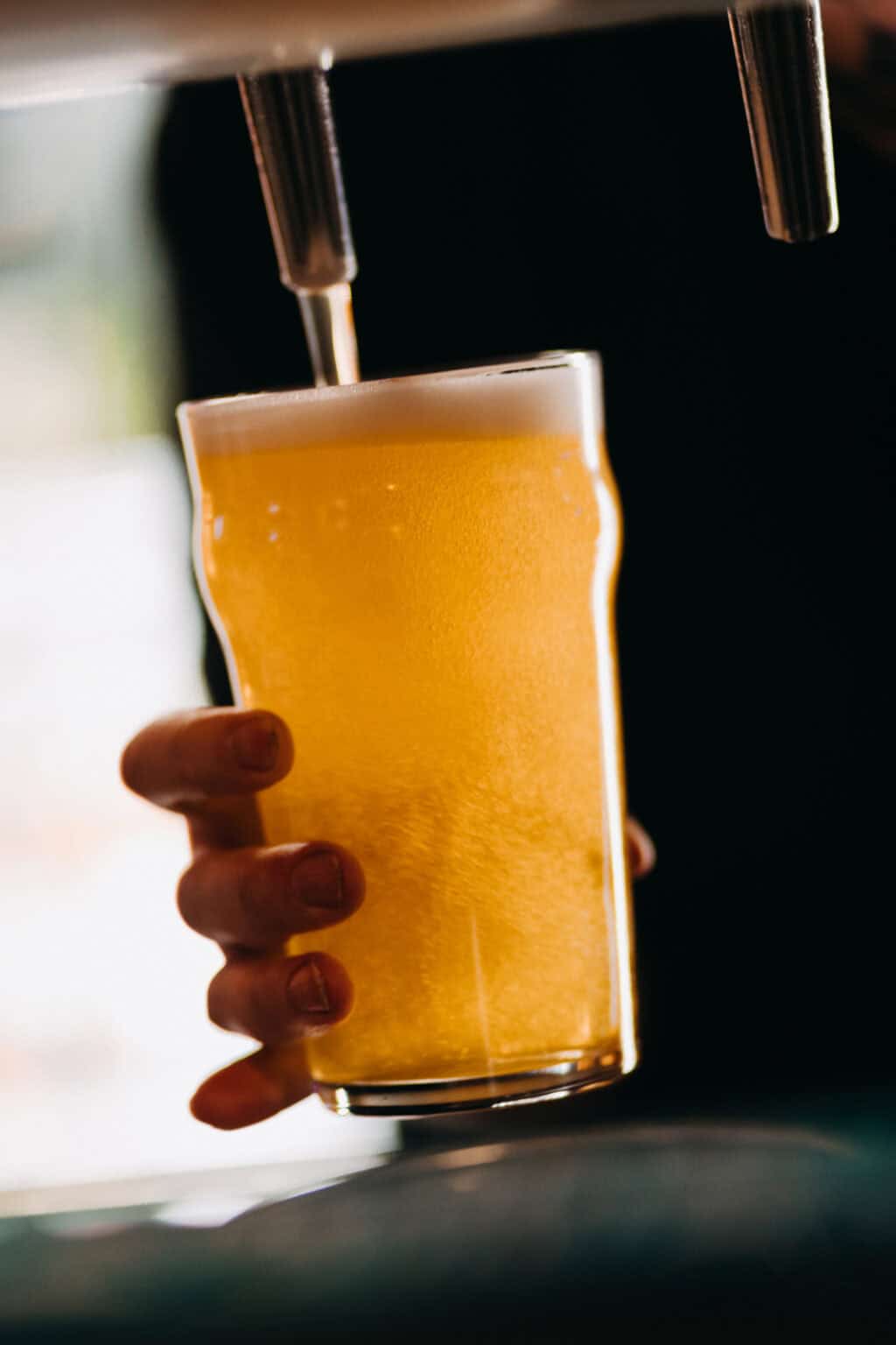 Fresh beer being poured from tap at St Christopher’s Berlin hostel.