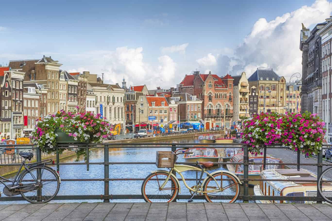 Uptown Hostel Amsterdam with scenic canal view and historic buildings.