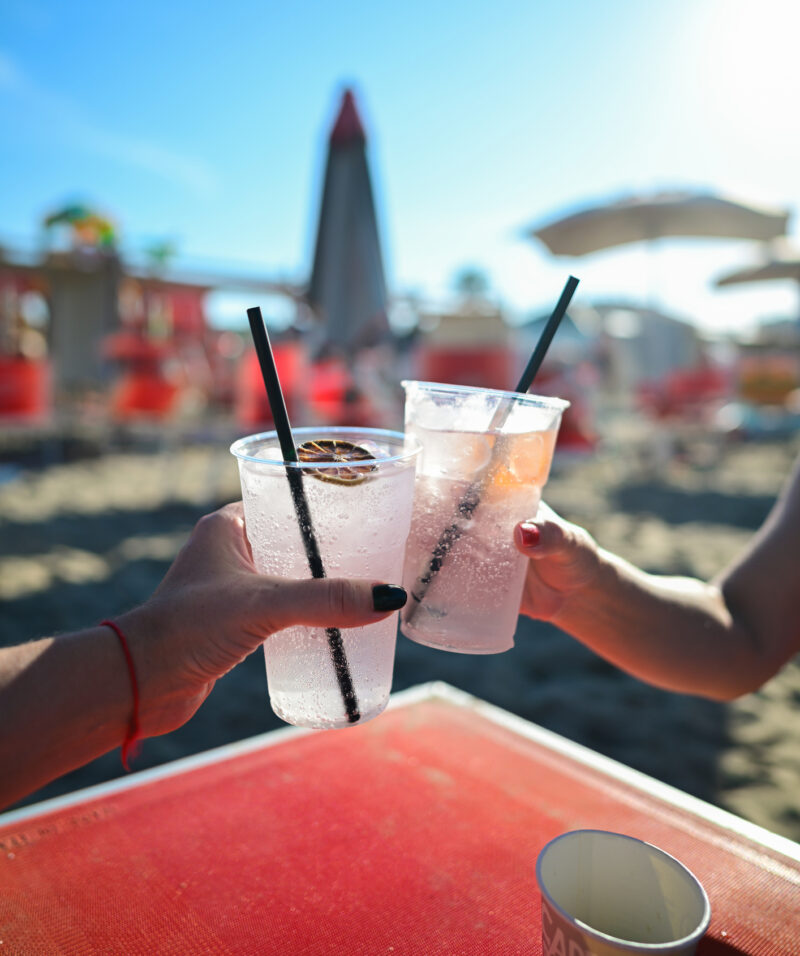 Cheering refreshing drinks on a sunny beach vacation