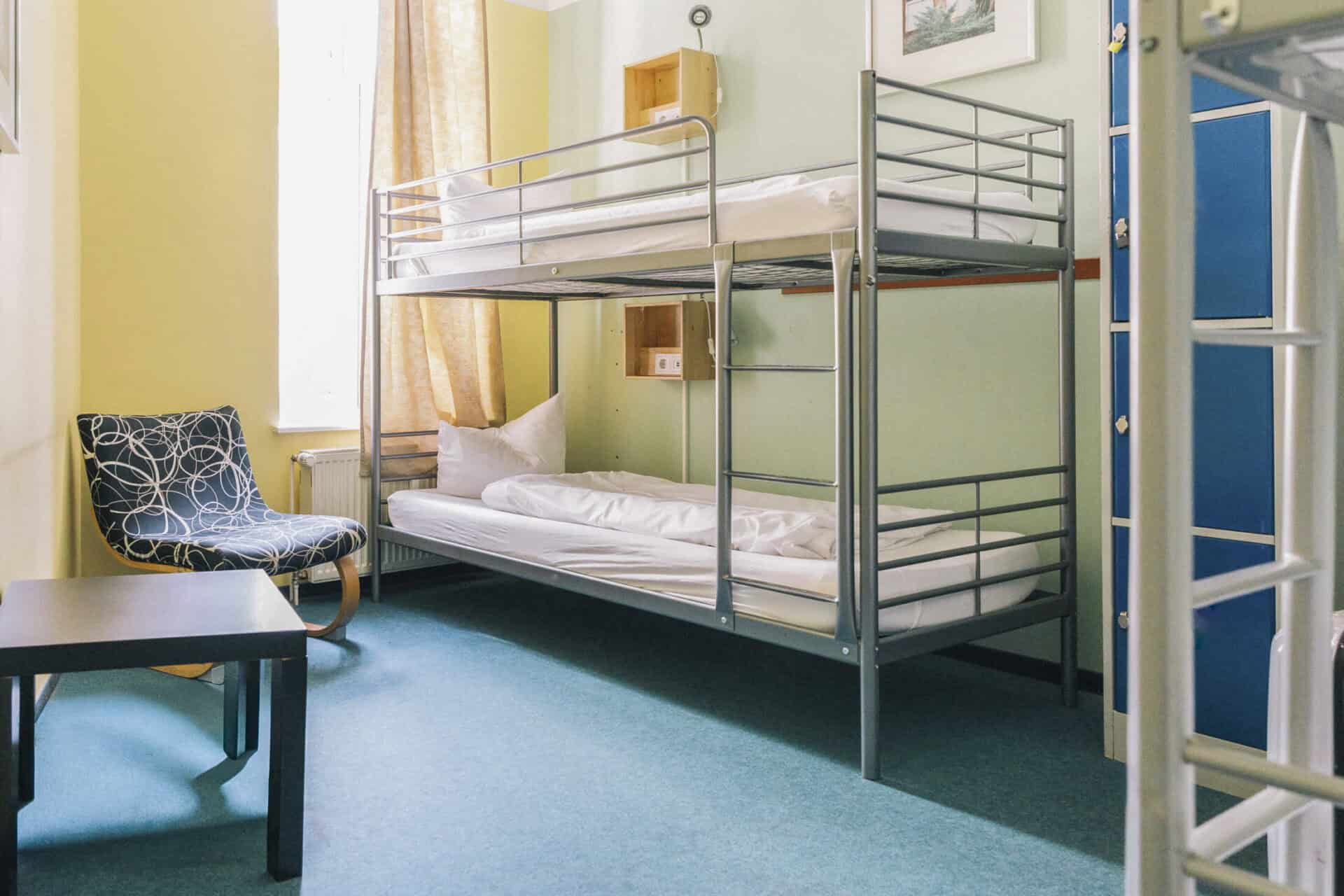 Bunk beds in a bright hostel room at St Christopher’s Berlin - Alexanderplatz.