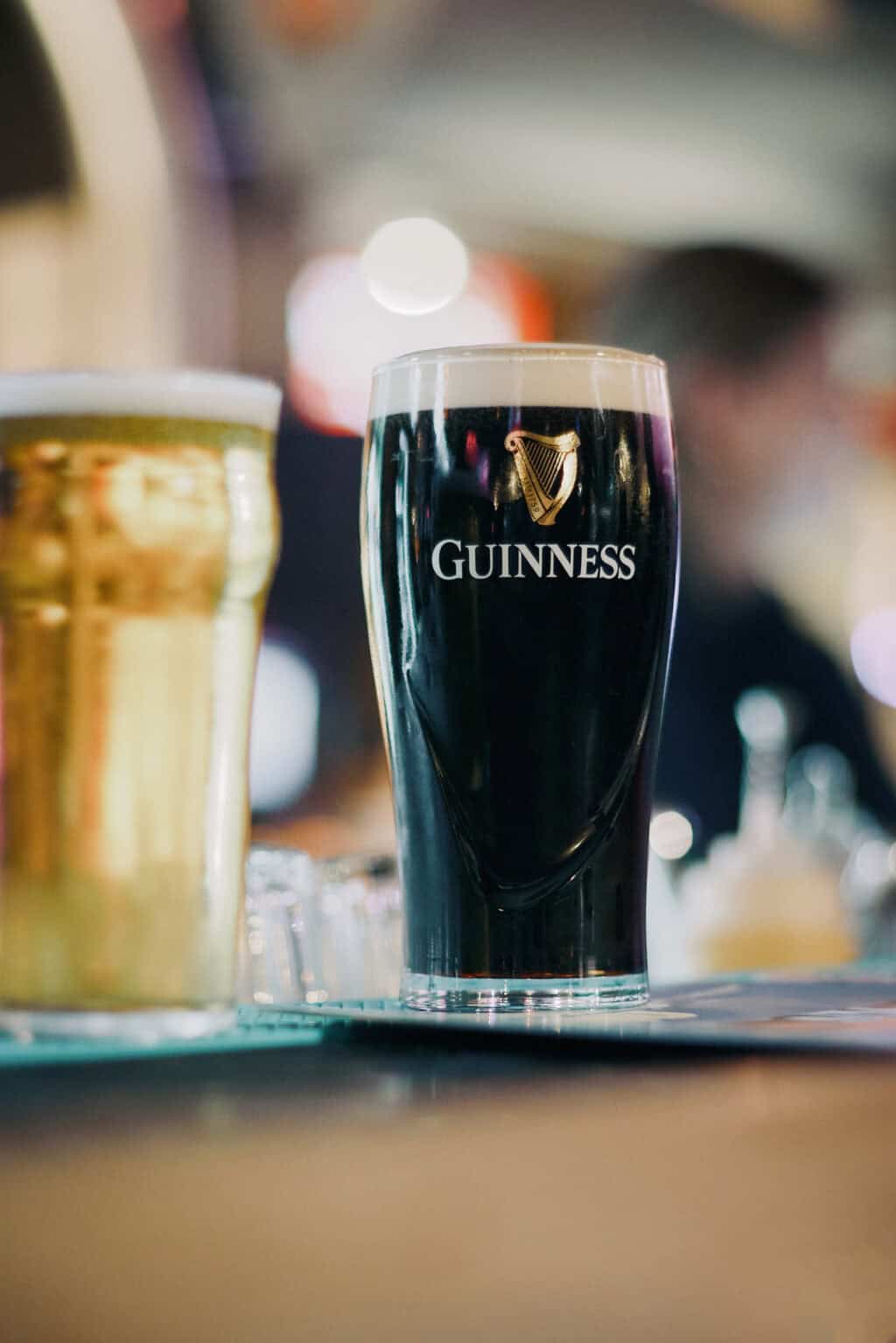 Pint of Guinness stout on a bar counter at Alexanderplatz Hostel, Berlin.