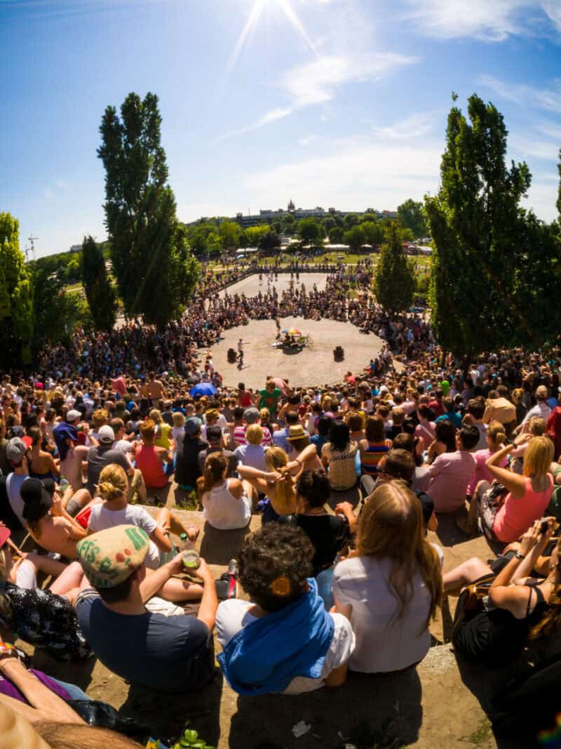 Outdoor event at St Christopher’s Berlin - Mitte with large crowd and scenic park view.