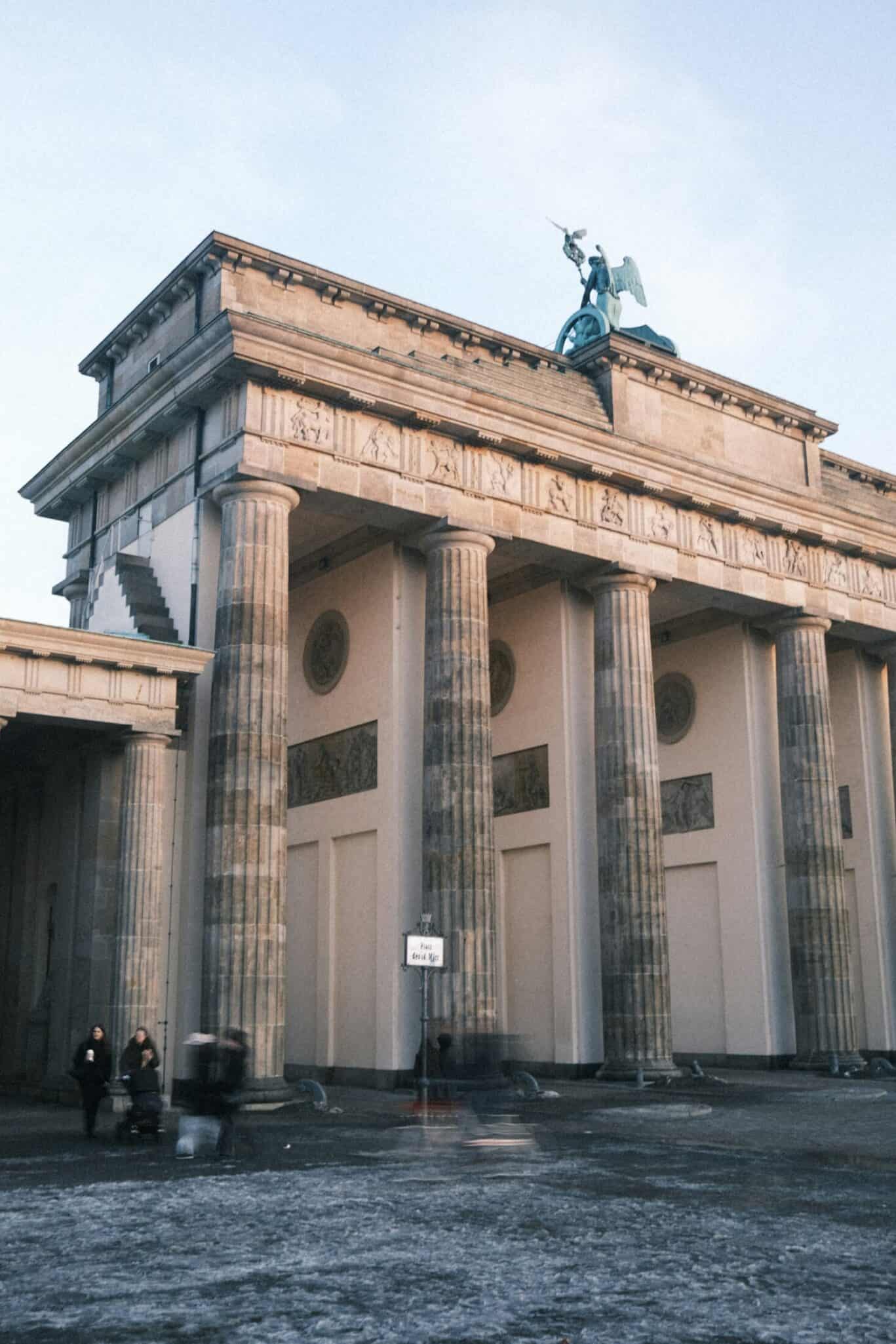 Berlin Brandenburg Gate, historic neoclassical monument in Berlin, Germany, symbolising unity and pe.