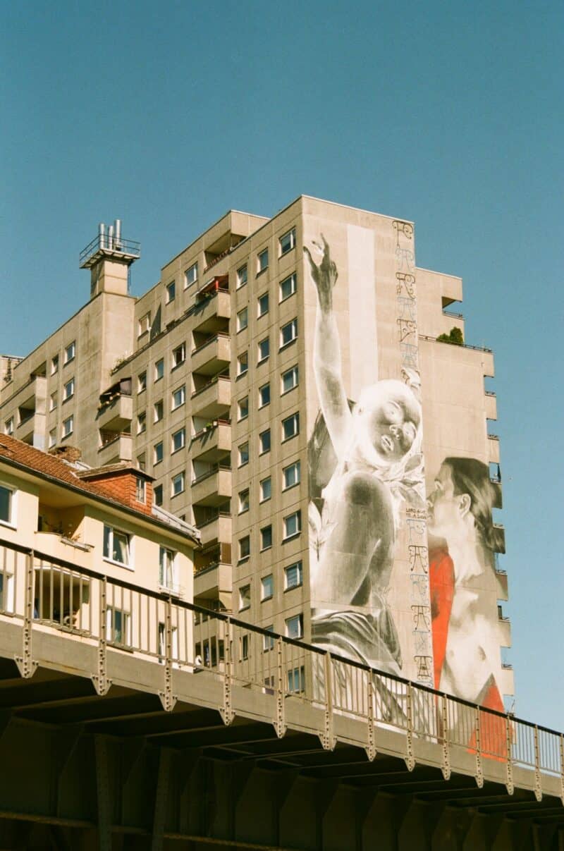 View of Berlin Mitte hostel building with street art mural, St Christopher's Inns nearby.