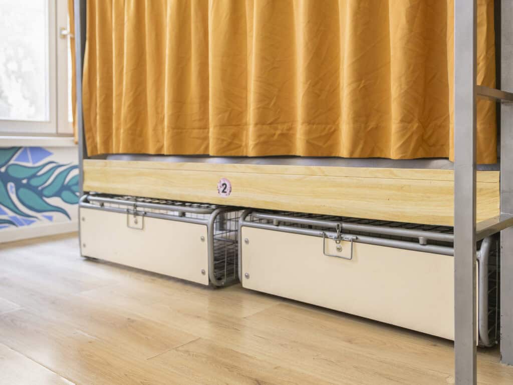 Bunk beds with built-in storage drawers at St Christopher’s Bruges - The Bauhaus.