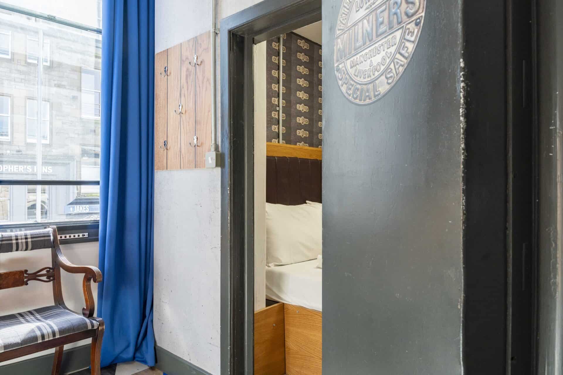 Cozy hostel room with a view of the city in Edinburgh's historic Old Town.