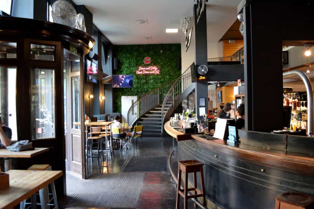 Interior view of the lively hostel bar and lounge area.