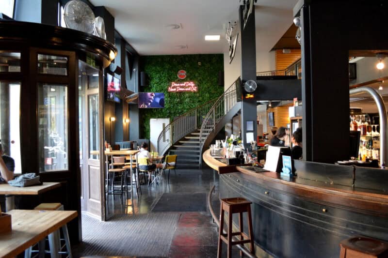 Interior view of the lively hostel bar and lounge area.