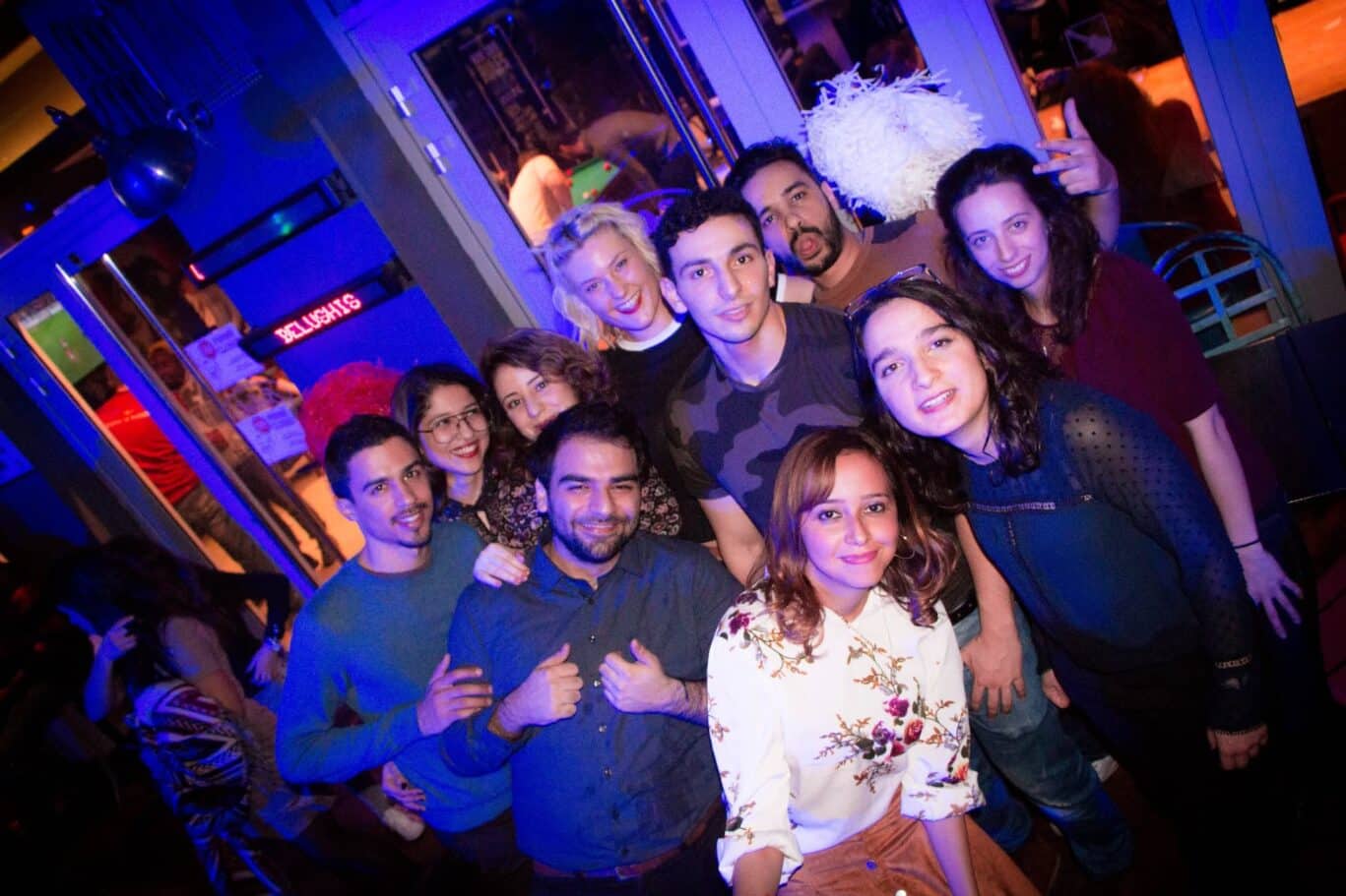 Group of young friends enjoying nightlife at St Christopher’s Paris hostel near Gare du Nord.