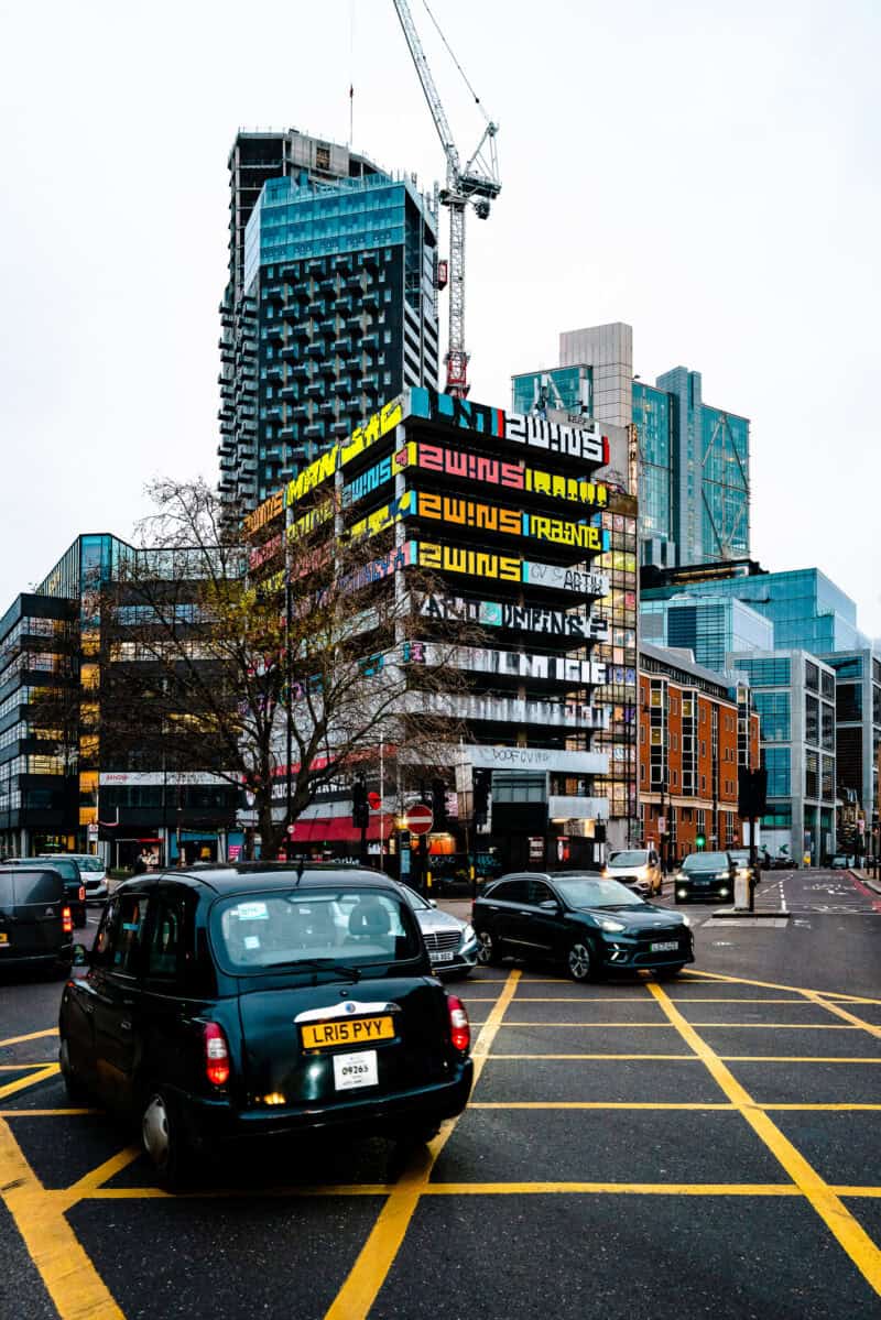 View of St Christopher's Liverpool Street hostel with cityscape and construction site.