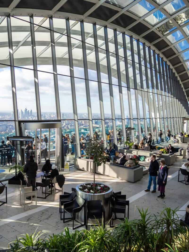 Modern glass architecture at St Christopher's Liverpool Street with city views and social spaces.