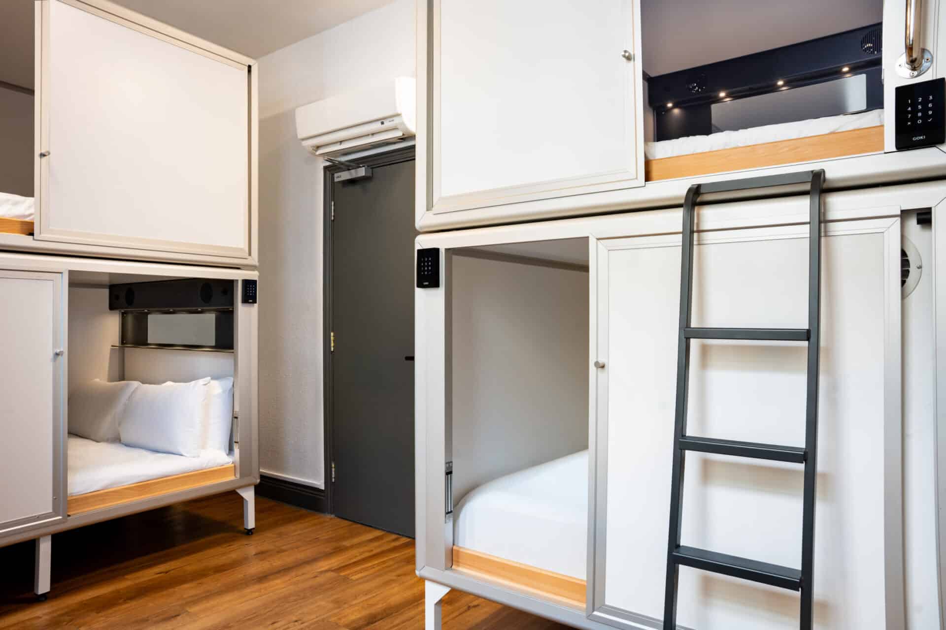 Interior view of bunk beds and sleeping pods at St Christopher’s London Bridge hostel.