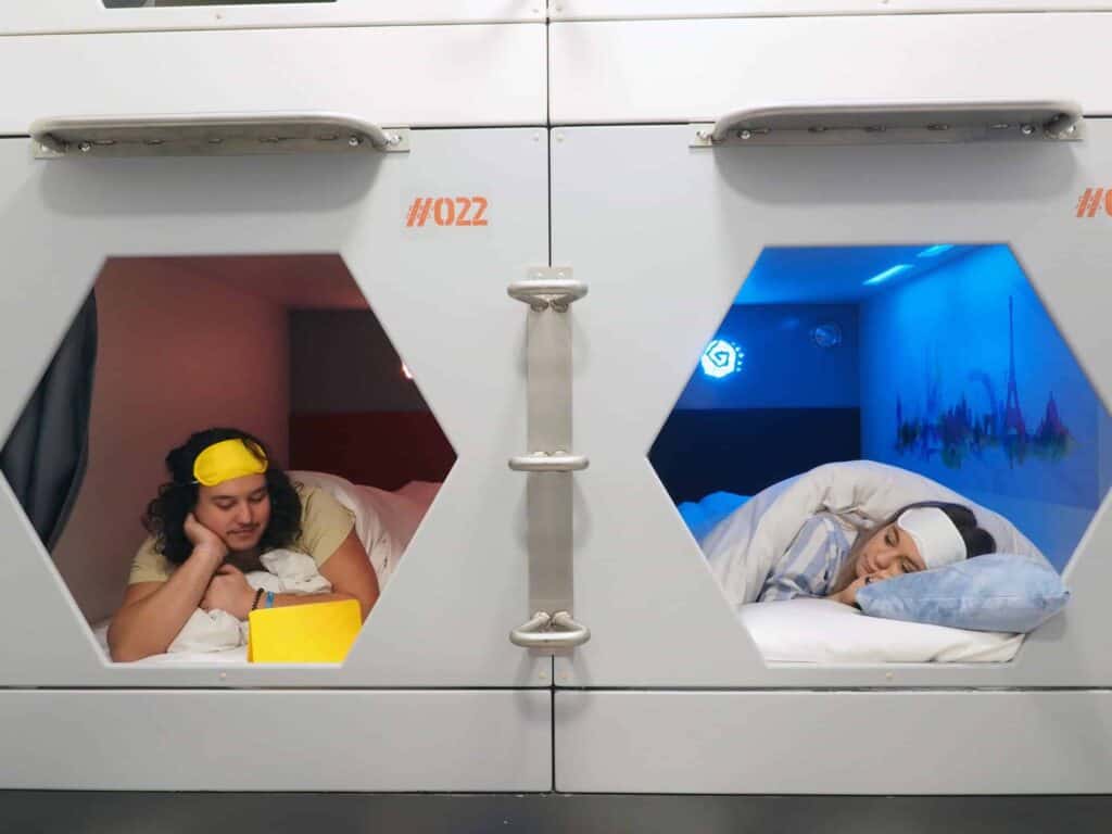 Modern co-living pods with private sleeping areas at London Bridge Hostel.