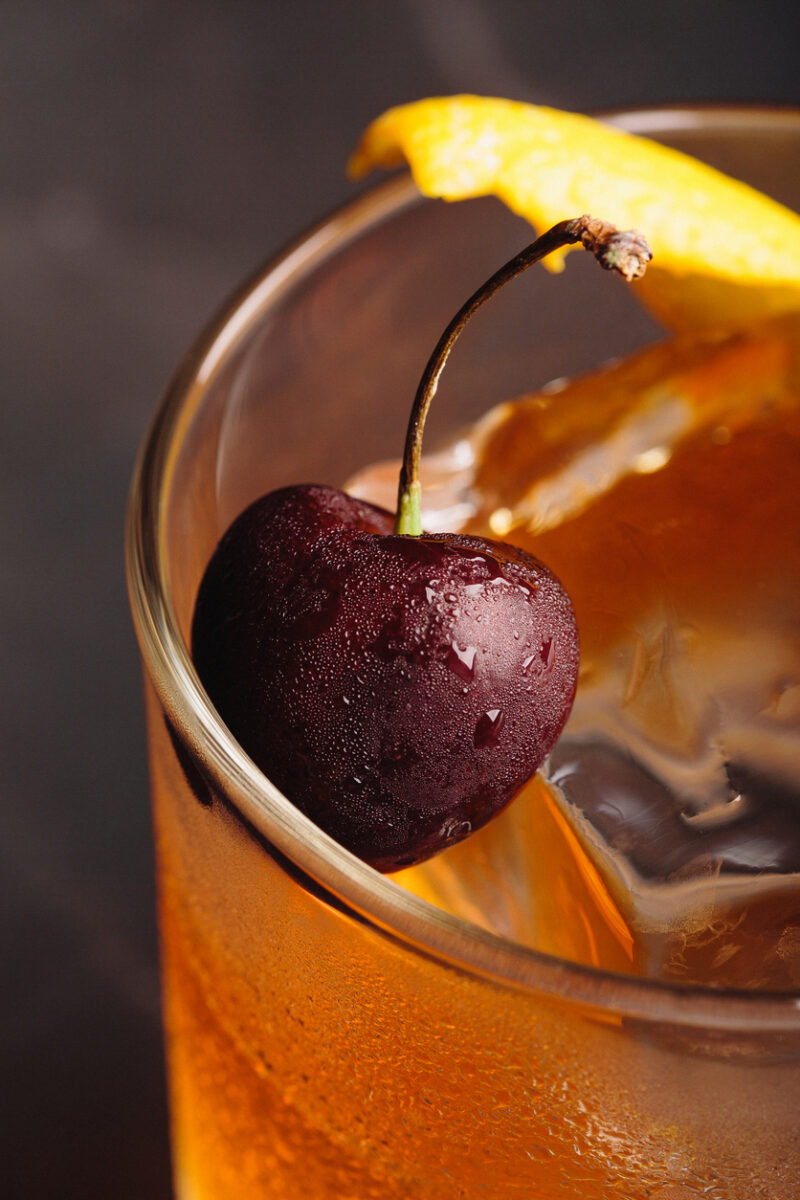 Old Fashioned Cocktail booze bourbon whiskey, sugar cube and aromatic bitters
