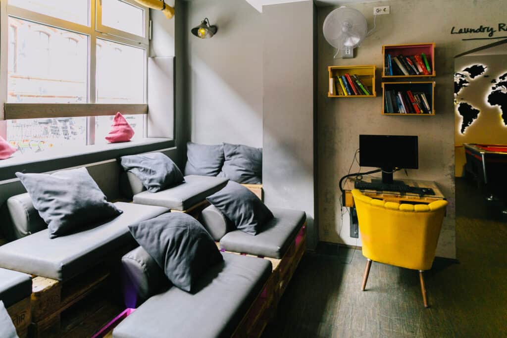 Comfortable hostel lounge with sofa seating and colourful decor in Berlin Mitte.