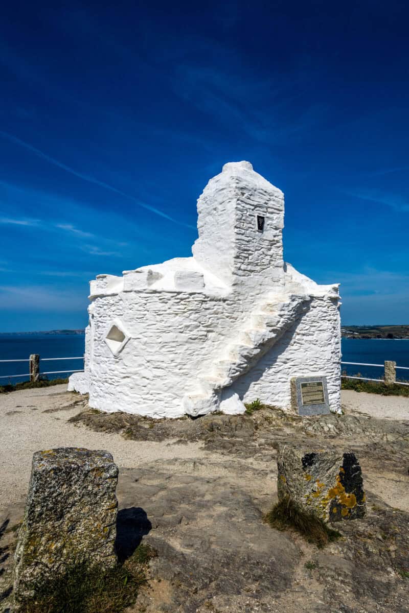 Blue sky over the old white huer’s hut building on the coast