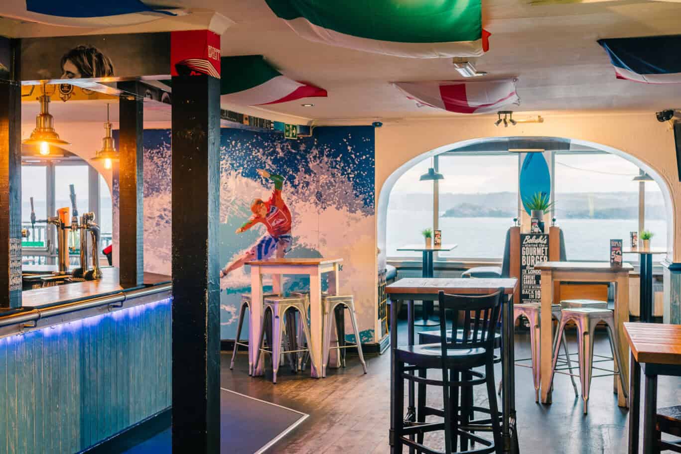Beachside bar at St Christopher’s Newquay hostel with ocean views.