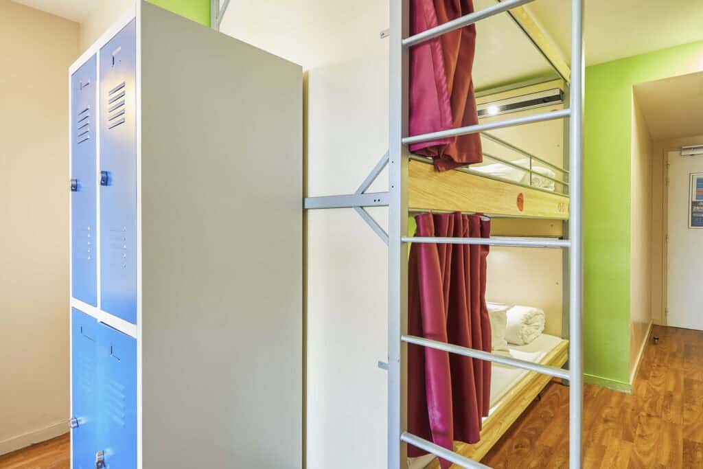 Modern hostel dorm with lockers and bunk beds at St Christopher’s Paris - Canal.