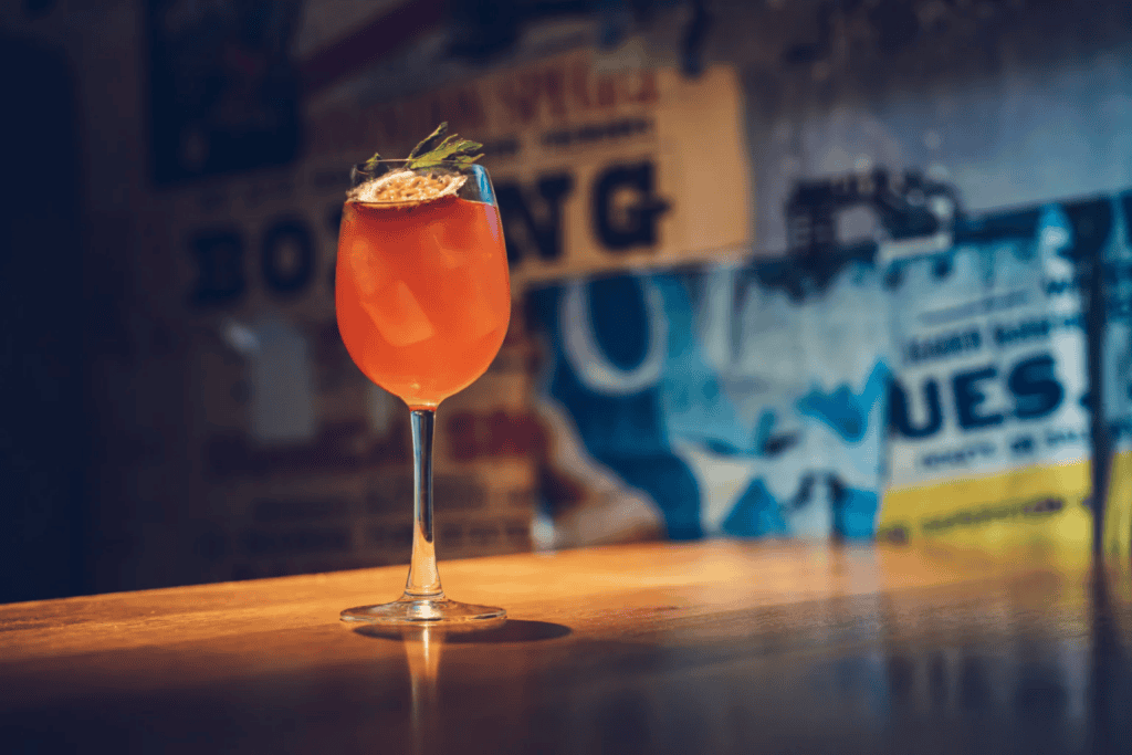 Colourful cocktail served at St Christopher’s Vienna hostel bar.