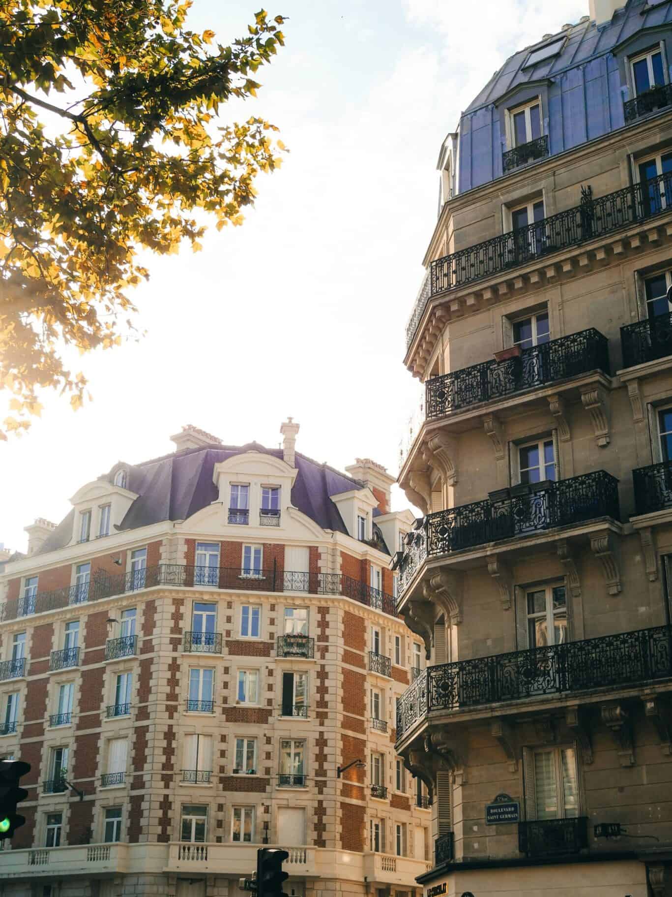 Historic Parisian building with ornate balconies and classic architecture.
