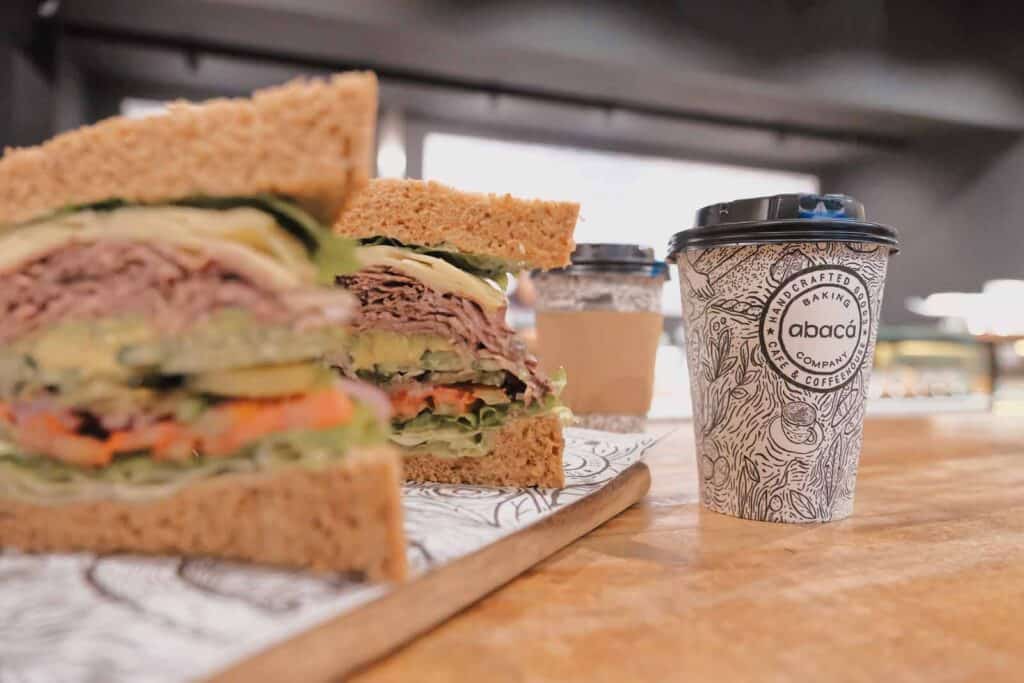 Sandwich and coffee at St Christopher’s Berlin hostel, showcasing a casual dining experience.