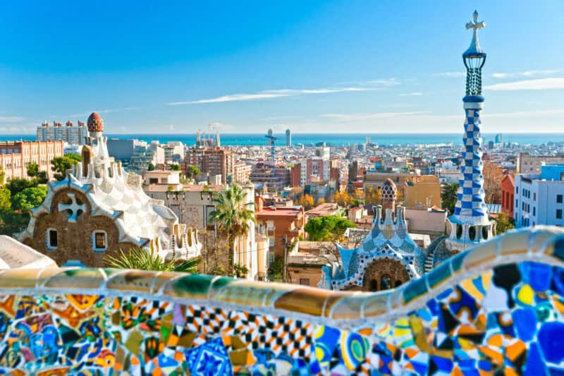 Panoramic view of Berlin from Park Güell, featuring colourful mosaics and architectural details.