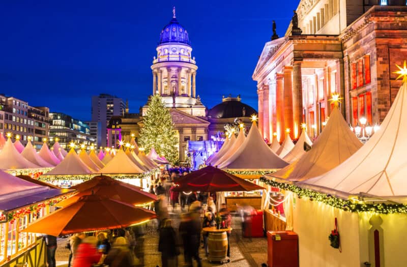 Christmas market stalls at St Christopher’s Berlin Mitte with festive lights and decorations.