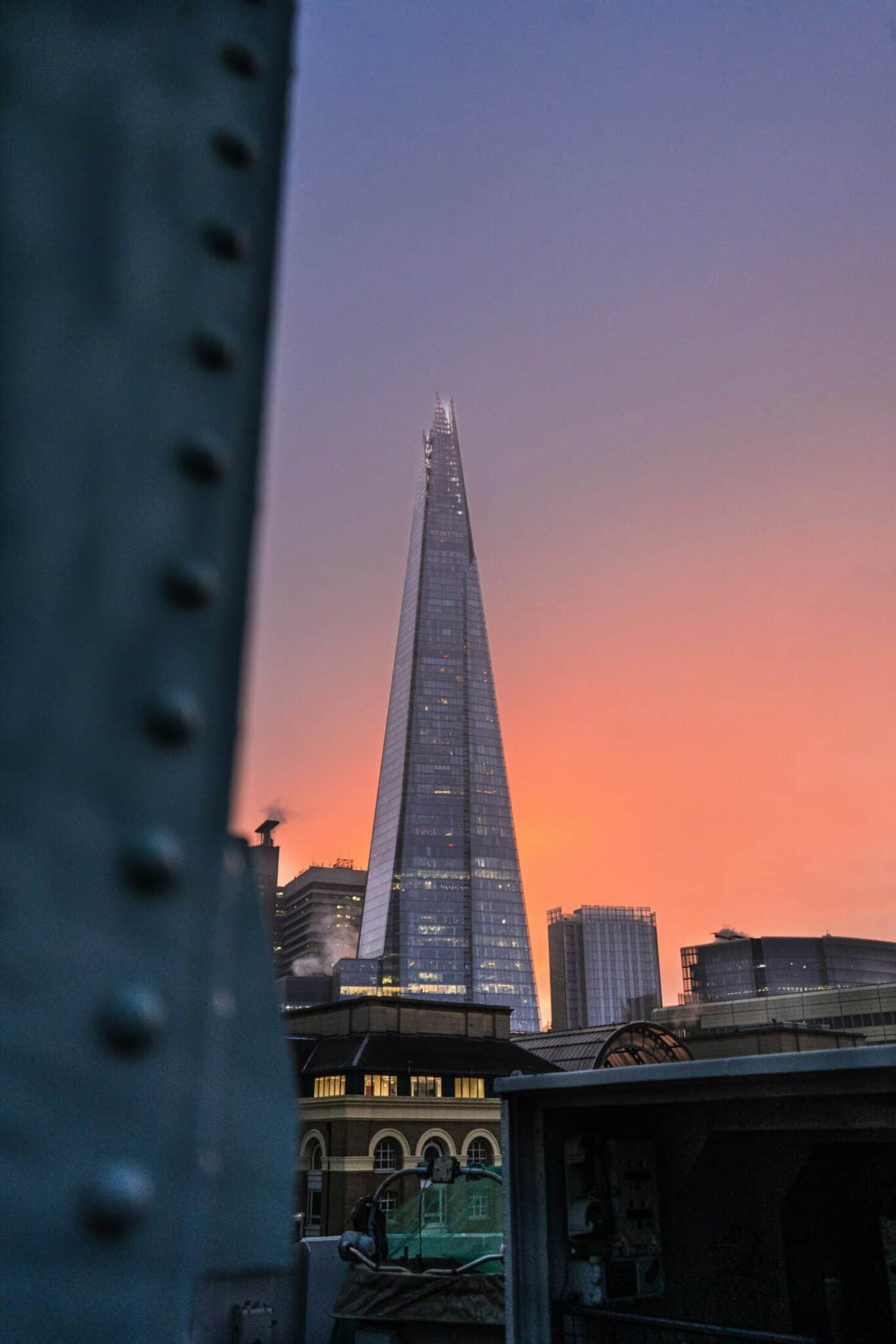 View of The Shard from a hostel in Mitte, Berlin, showing cityscape and sunset sky.