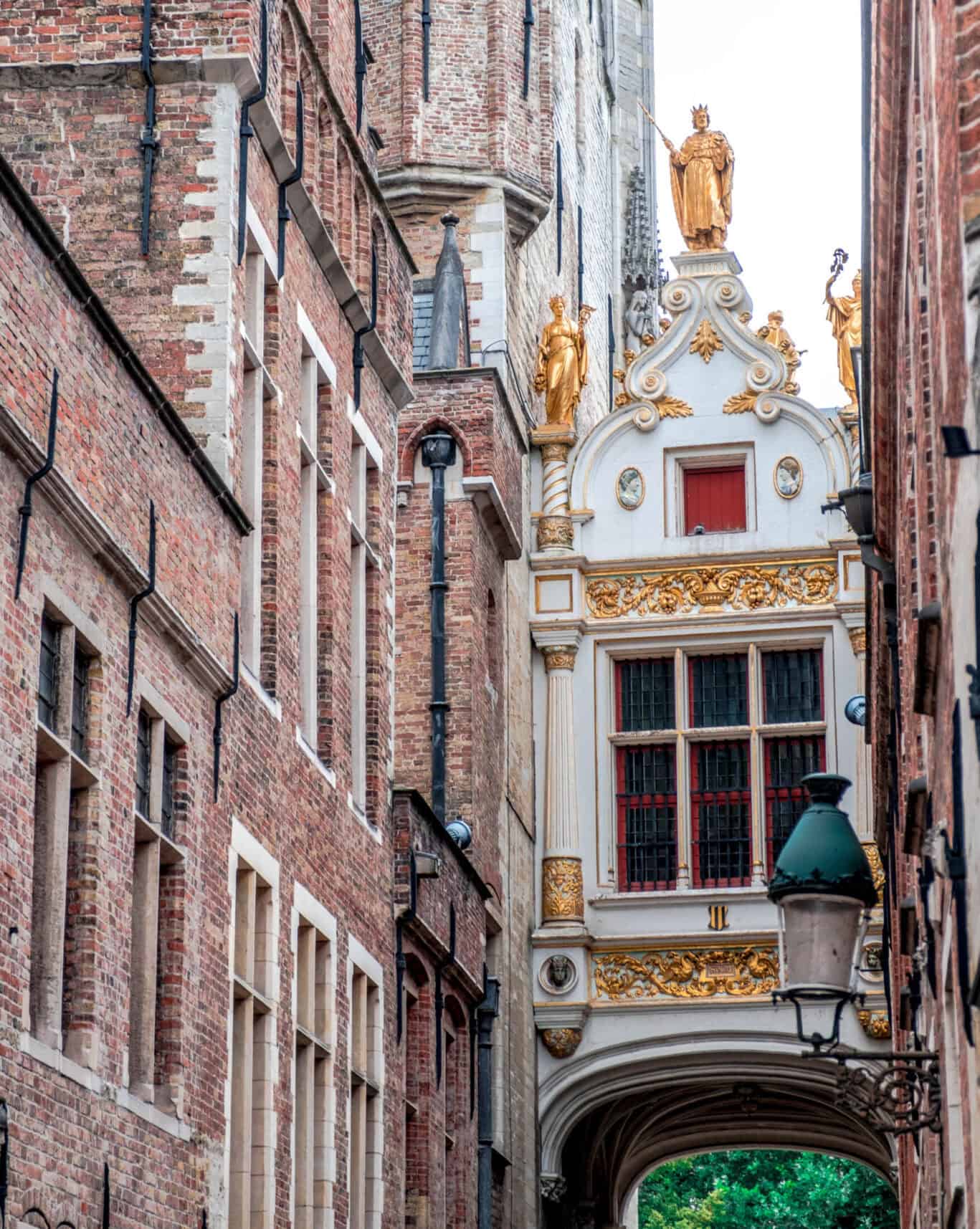 Ornate gilded medieval architecture in Bruges old town – stay at the best hostels in Bruges and explore on foot