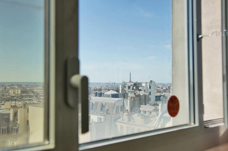 Eiffel Tower views across Paris rooftops from St Christopher's Inn – one of the best-value hostels in Paris, France