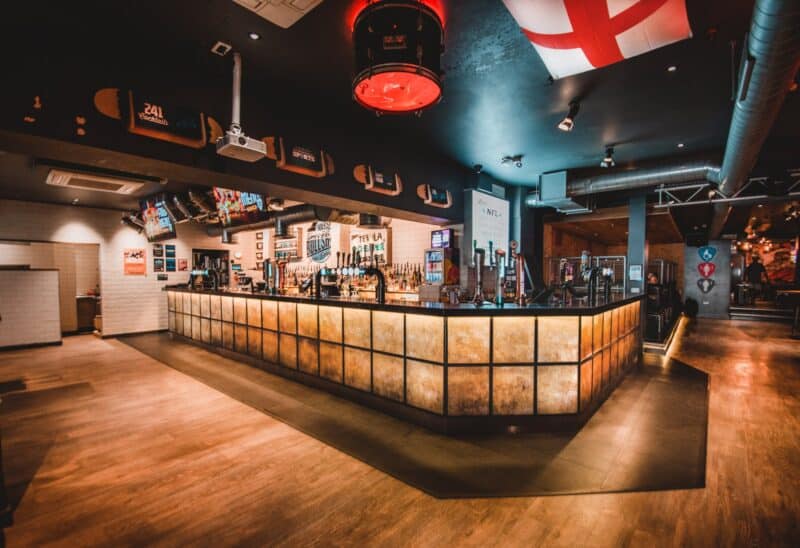 Modern bar interior at St Christopher's with warm lighting and contemporary decor.